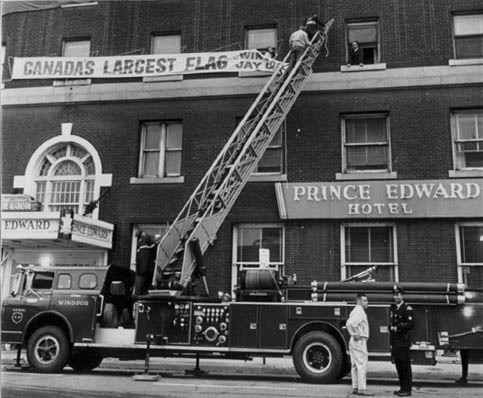 Aerial No. 4A helps hang Canada’s Largest Flag at the Prince Edward Hotel, 1967