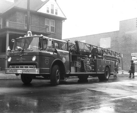 The LaFrance/Mercury Quint prepares to go into action at the Herald Press fire on Pitt St. W. in June, 1974