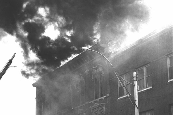 Flames roll from roof